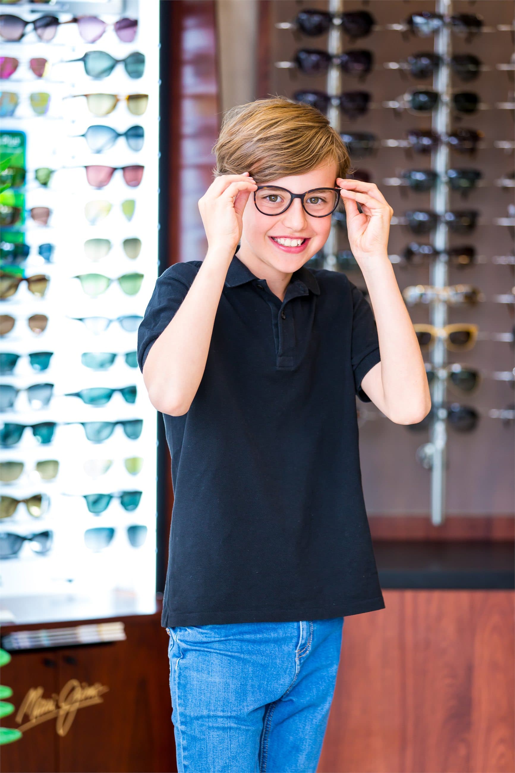 Ashburton Eyecare patient adjusting glasses in the practice