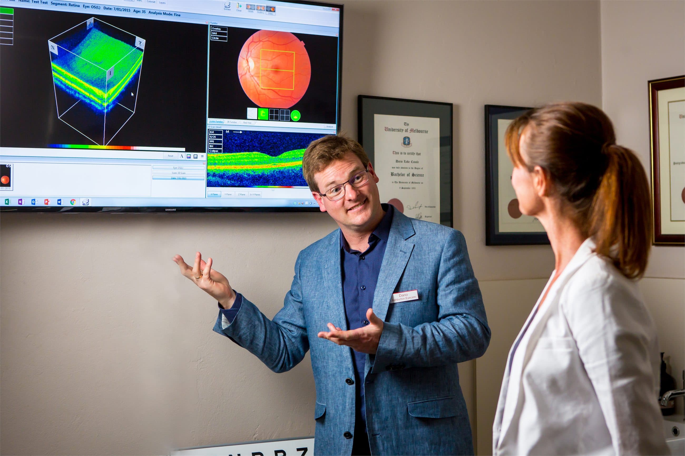 Ashburton Eyecare optometrist explaining scan results to a patient